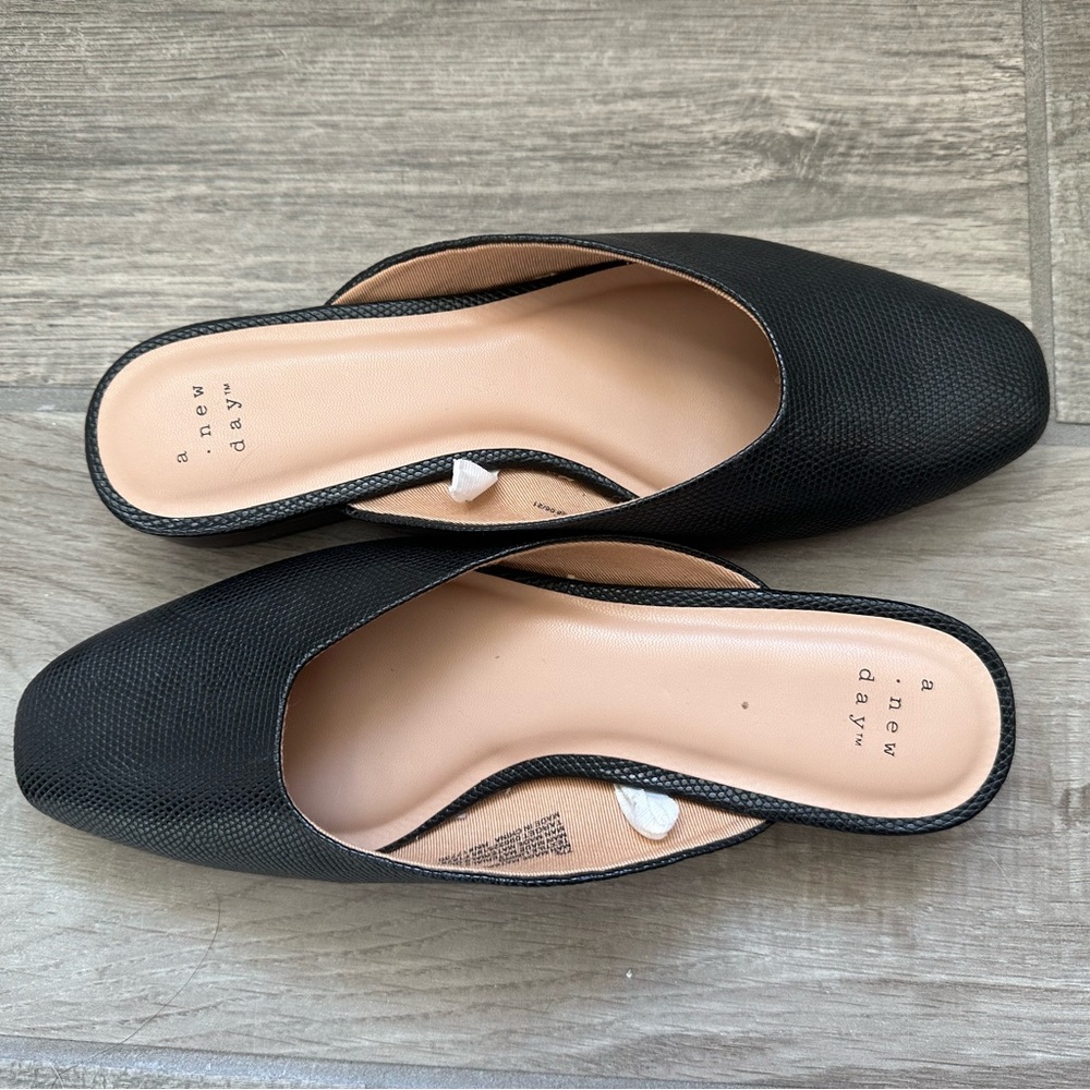 A new day black mule in size 7.5.
